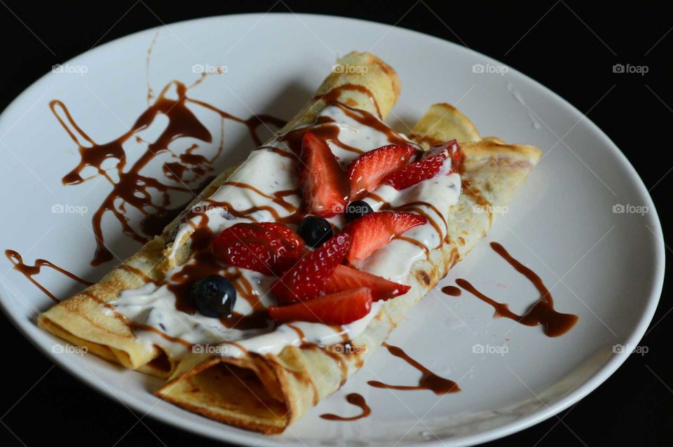 pancakes with fresh fruits, chocolate, and joghurt