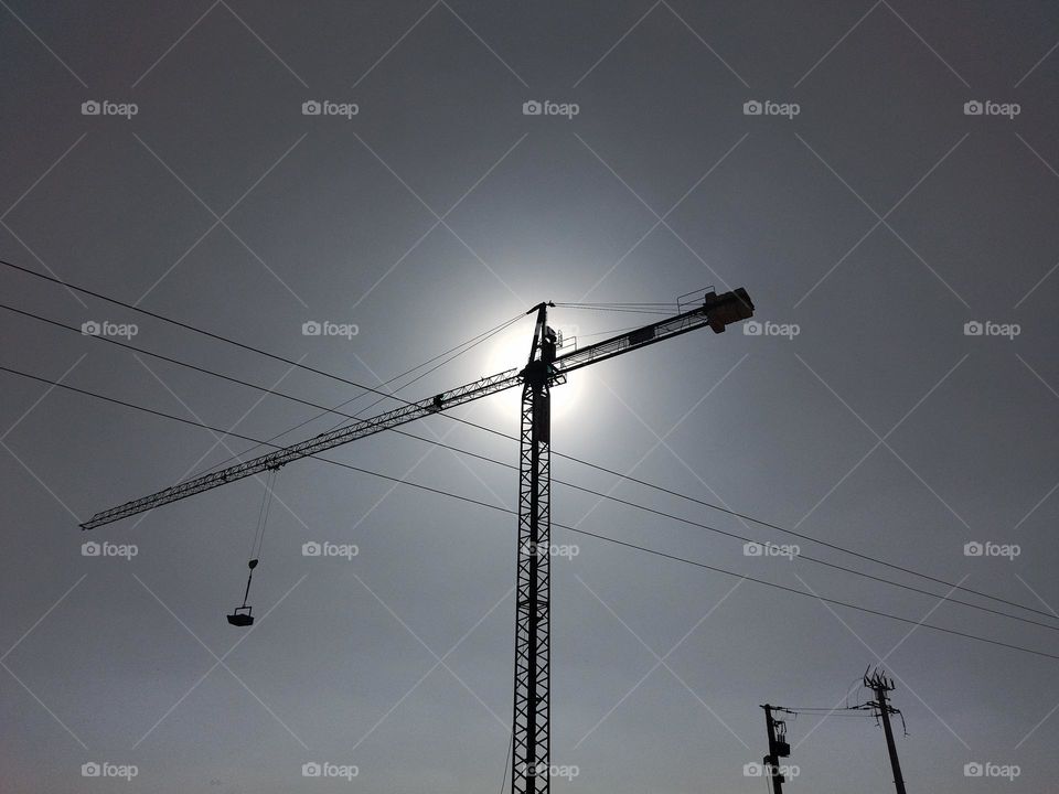 Crane and electric lines