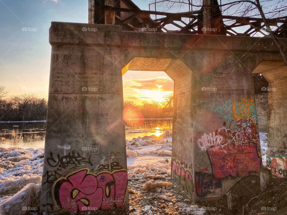 Abandon train bridge at sunset