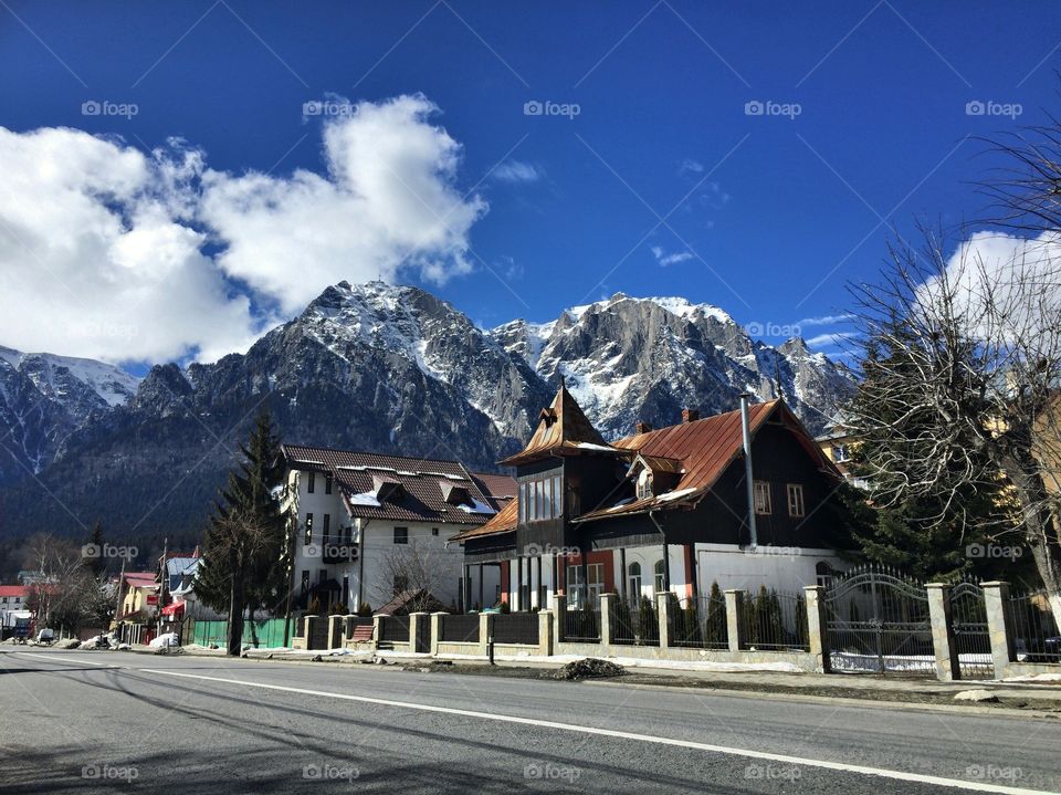 House in a village with steep mountains towards 