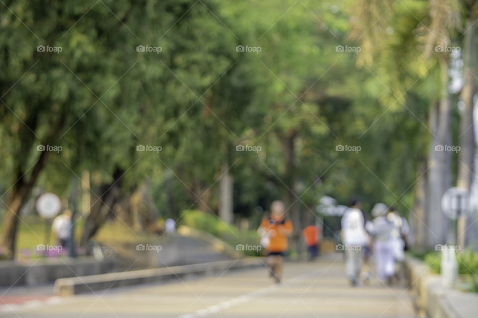 Blurry image people running exercise for health in the Benjakitti Park , Bangkok in Thailand.