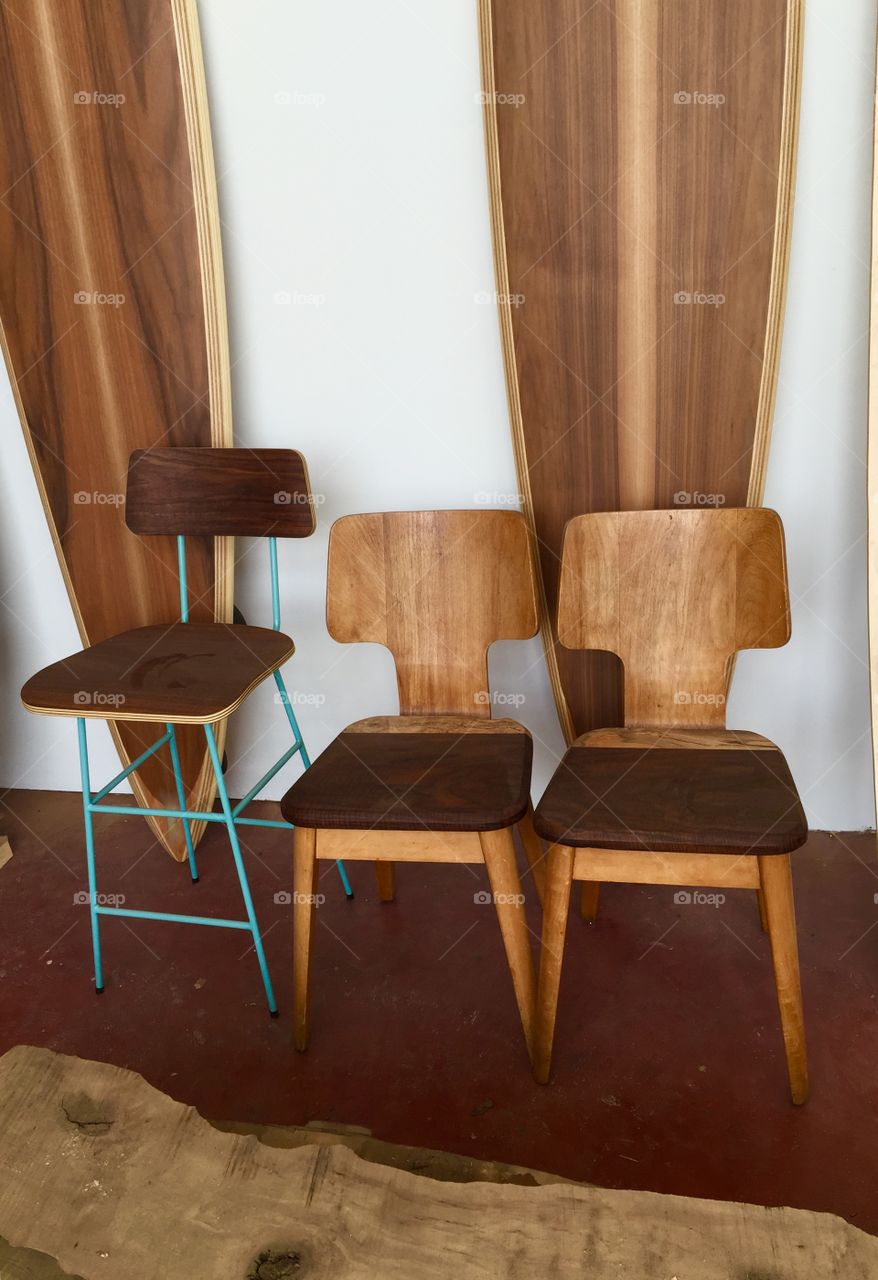 Modern wood chairs and surfboards