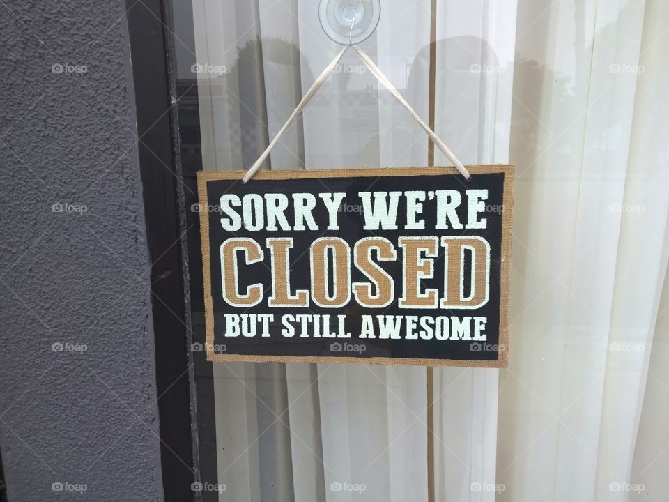 Sign that says, "sorry we're closed but still awesome"
