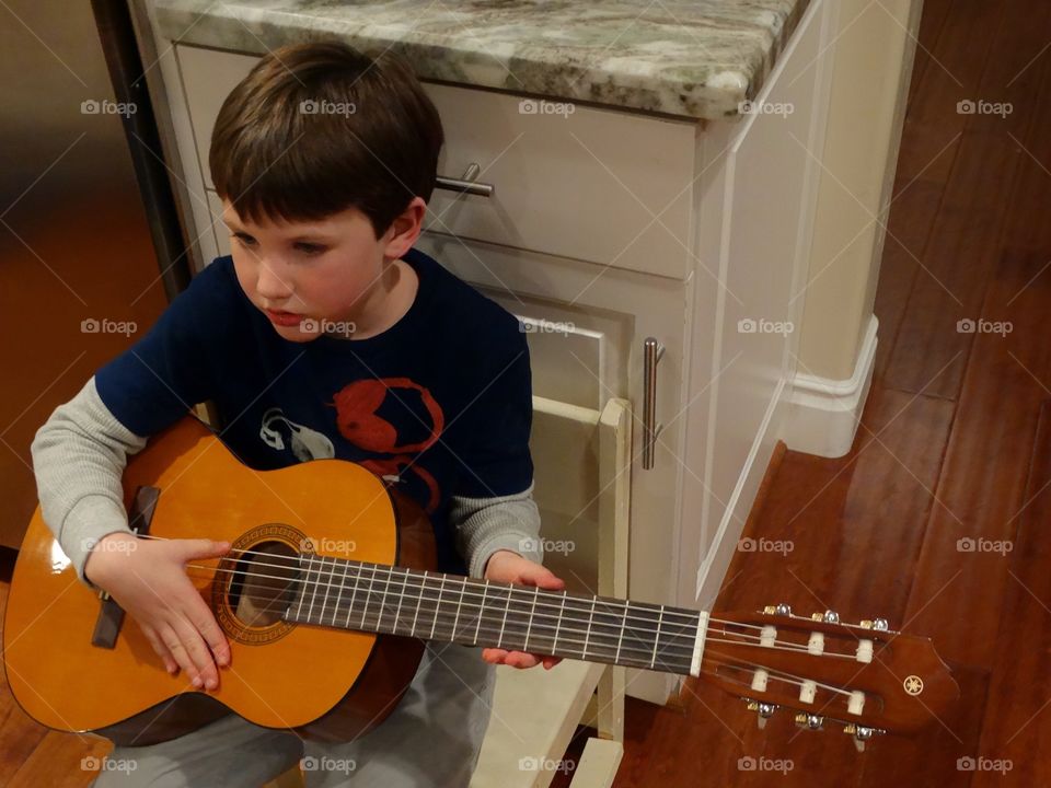 Boy Playing Guitar