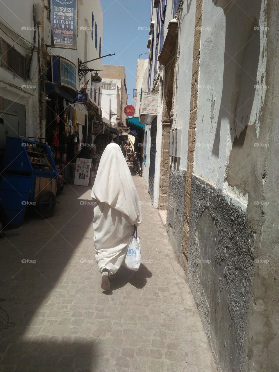 an old woman wearing moroccanb traditional clothes.