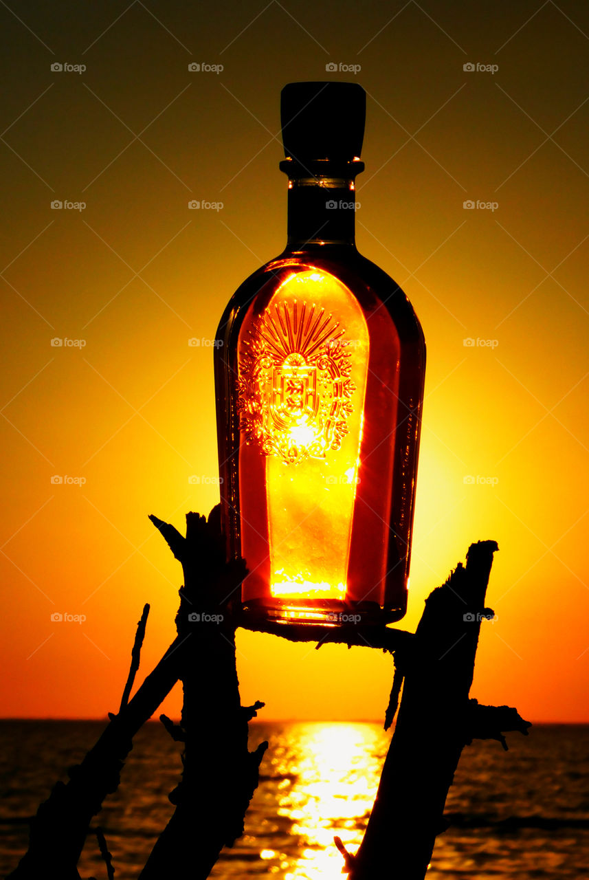 Sunset in a decorative bottle!
The sun was sinking behind the horizon, but left behind a magnificent sunset that cast its shimmering rays across the Choctawhatchee Bay