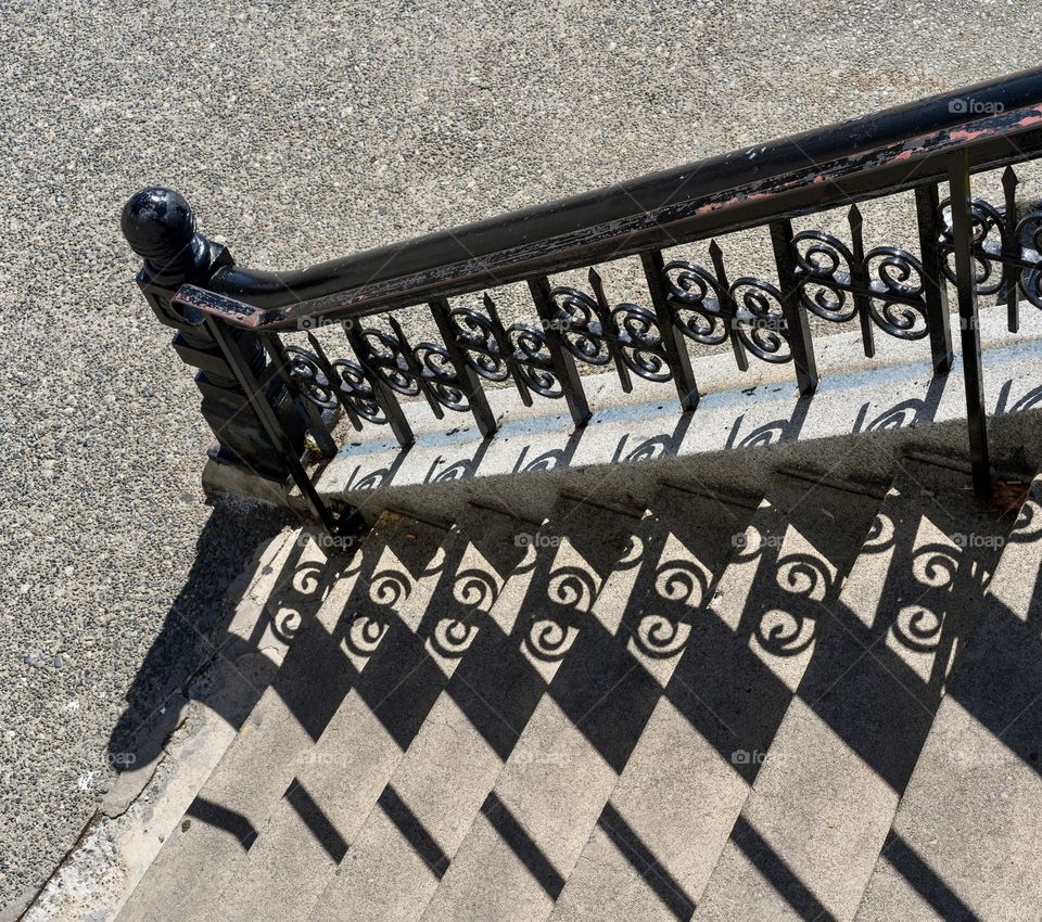 Wrought iron staircase with shadows 