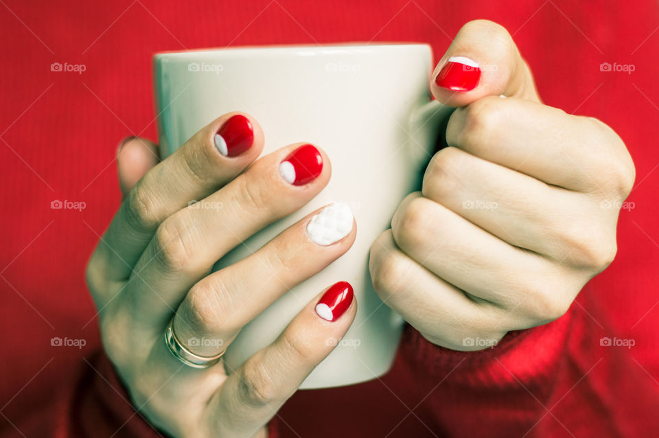 Woman holding cup of tea