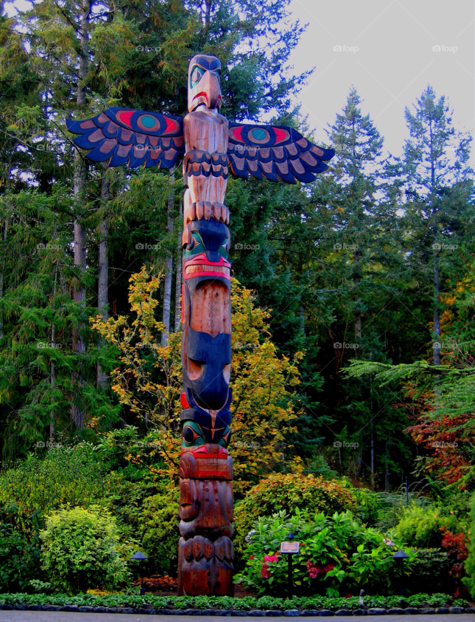 british columbia forest colorful totem pole by stevehardley7