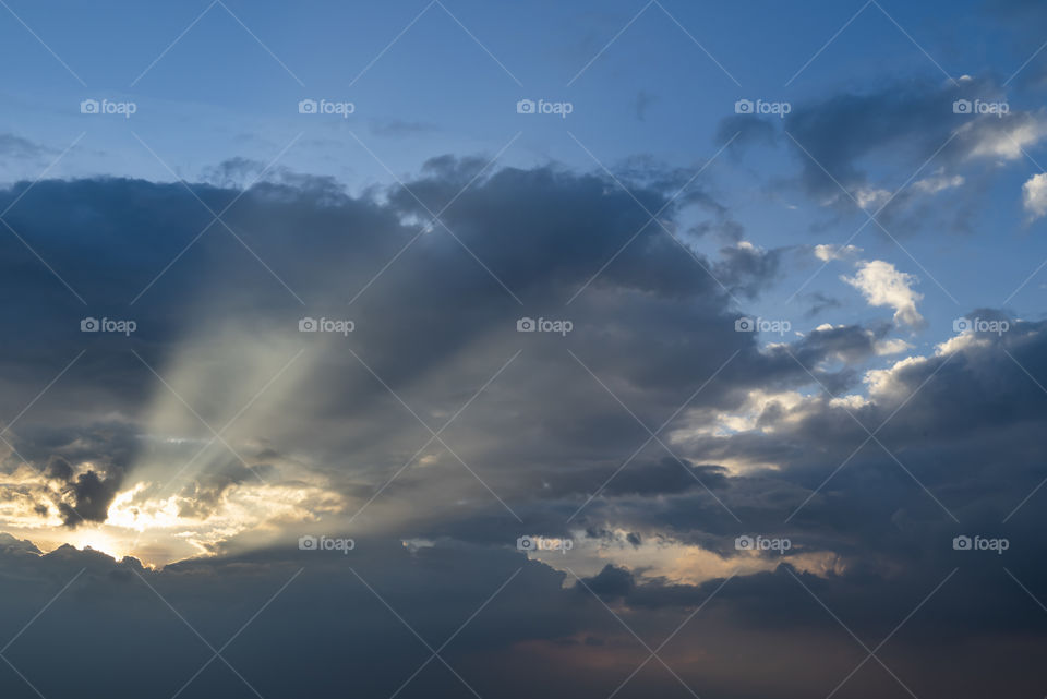 Beautiful sun light pass through dark cloud