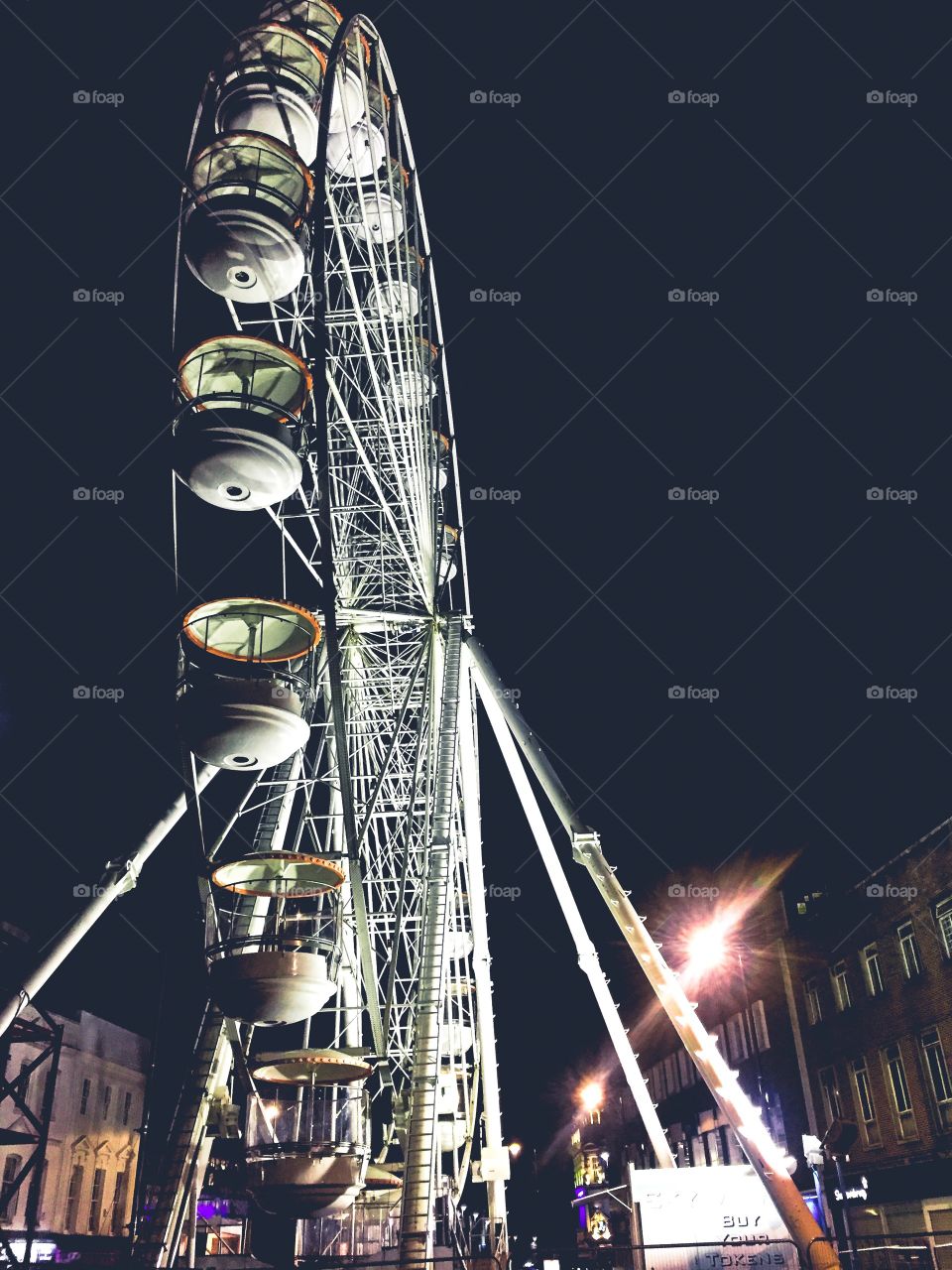 Ferris wheel in the night city lights