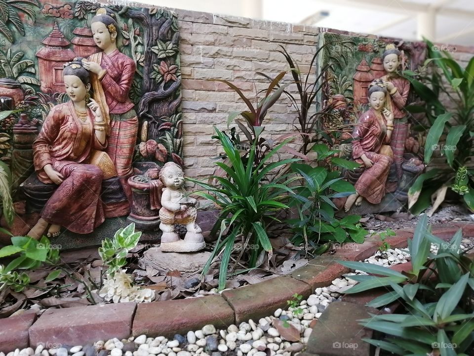 Outdoor​ garden​ with real plants and cultural related​ decors..!