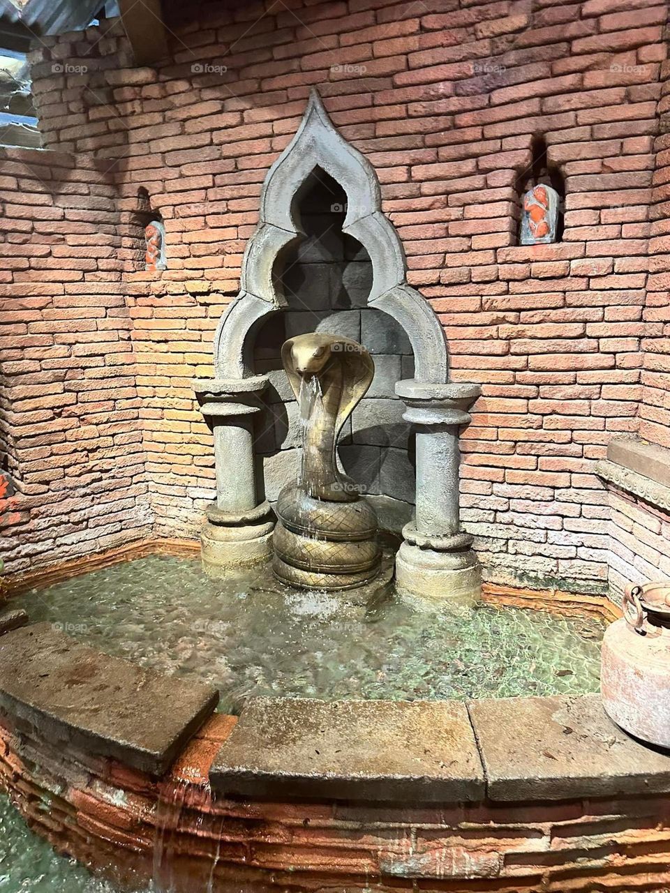 Statue and fountain in a ride queue 