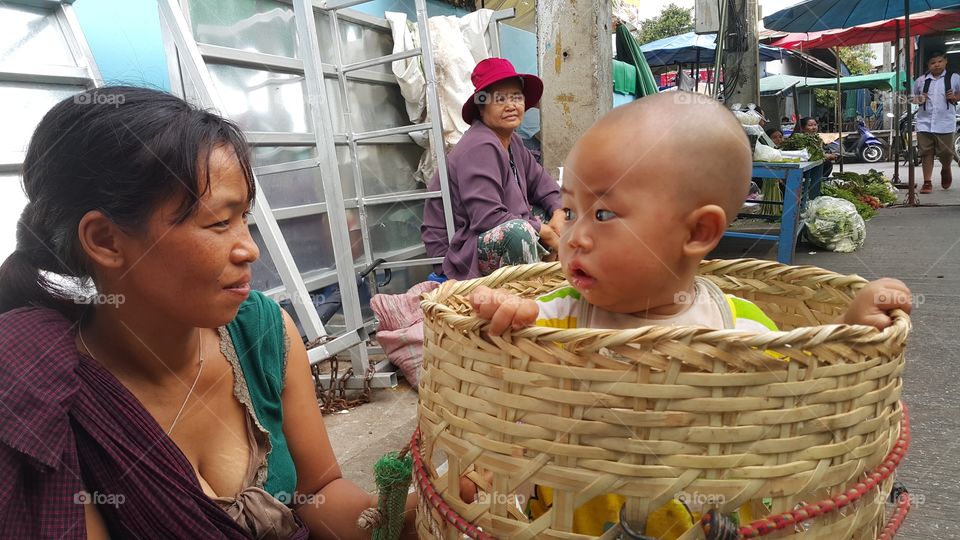 mother and child at evening market in Maesai Chaingrai