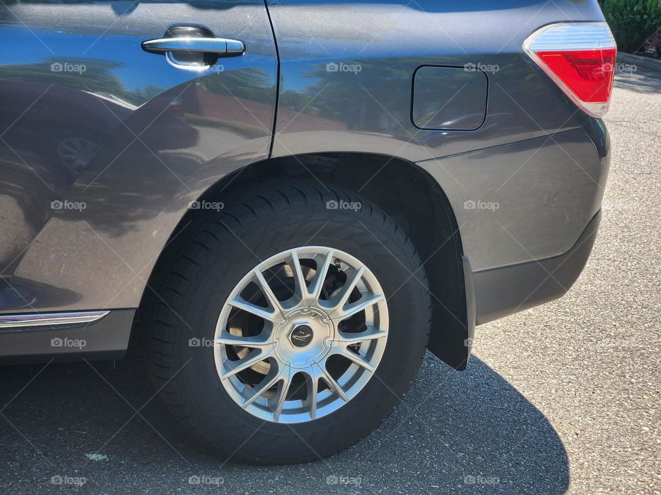 side of gray car wheel close up