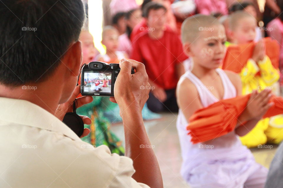 Photographer take a photo in festival.