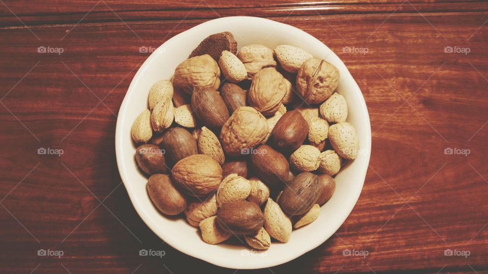 Bowl of nuts, overhead with filter.