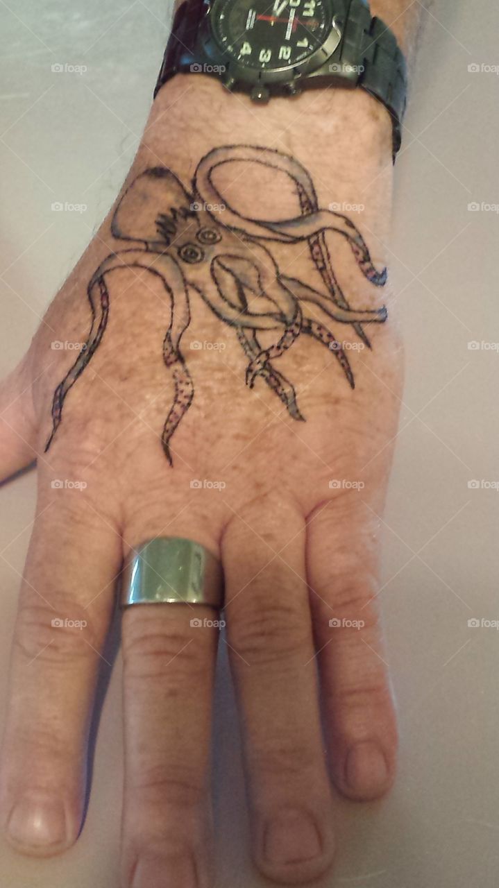 Octopus tattoo. my brothers hand.