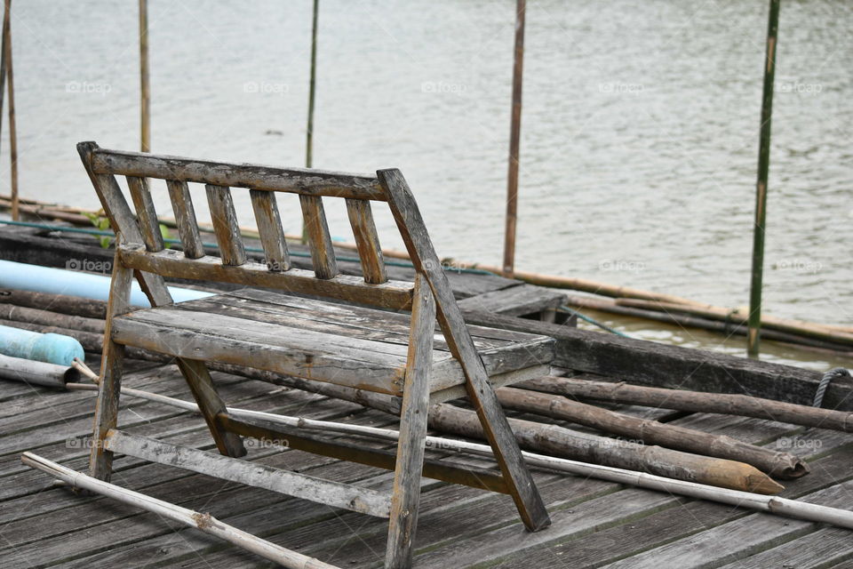 Old wooden bench beside the river.