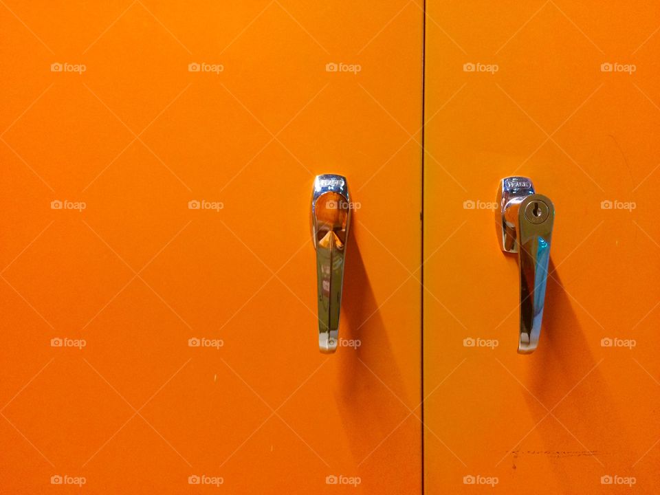Orange locker handle