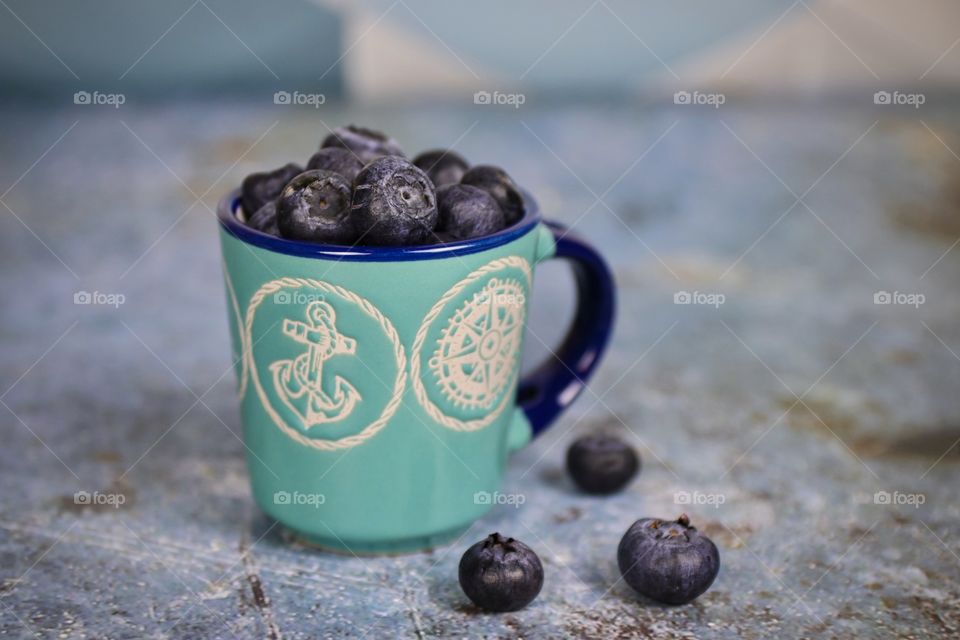 Blueberries in a small cup