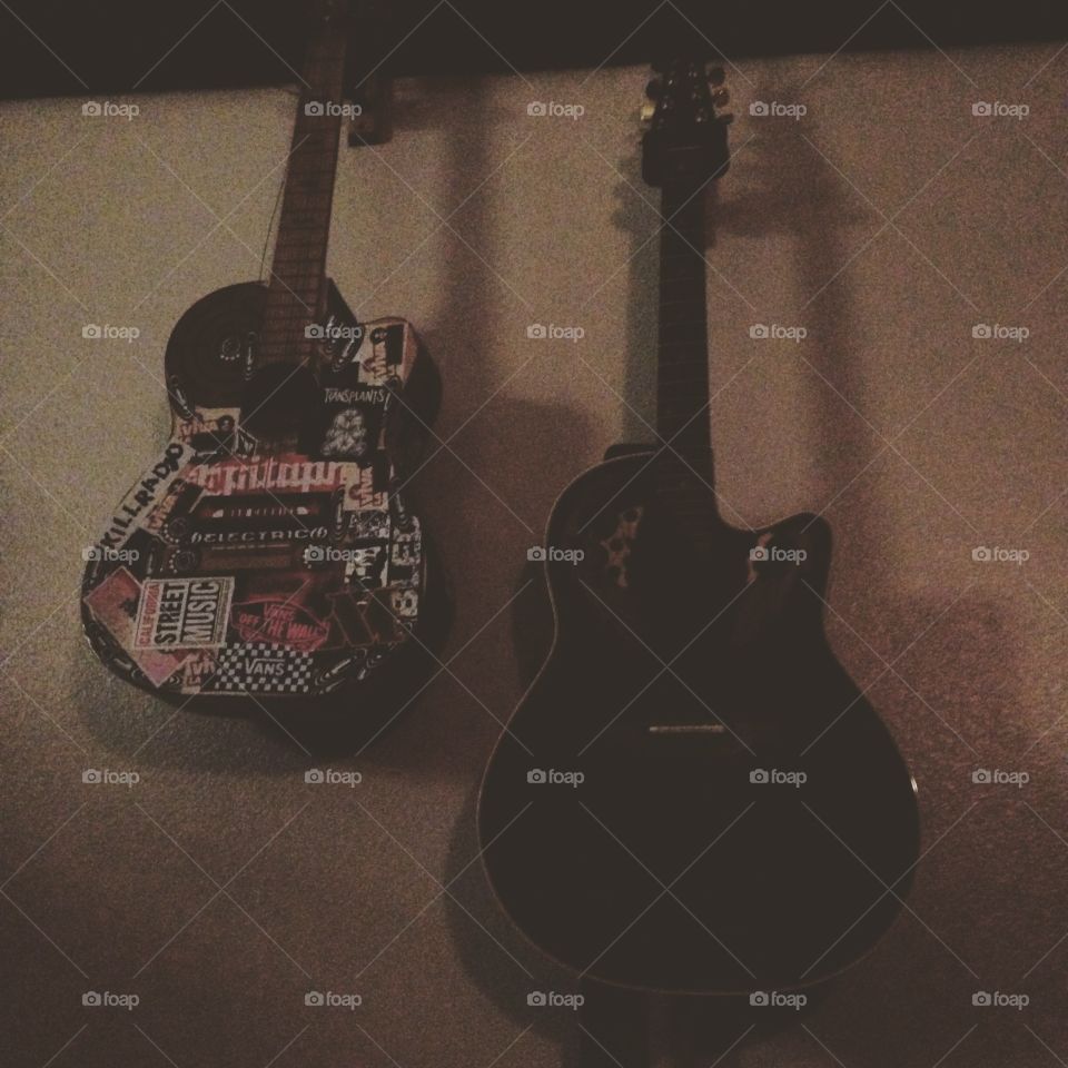 These Ol' Guitars. My guitars hanging on the wall in the cozy evening light.