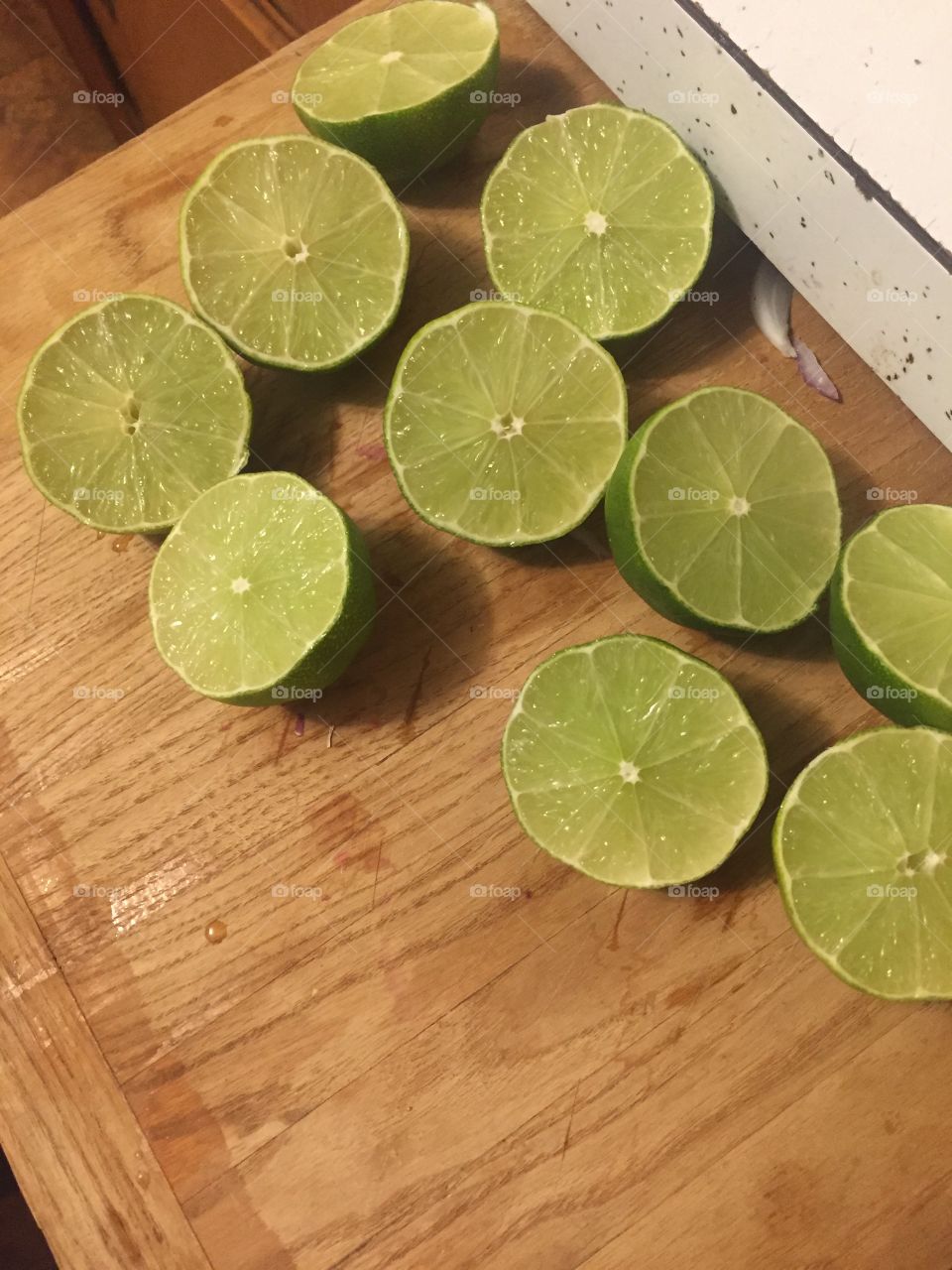 Limes on a cutting board