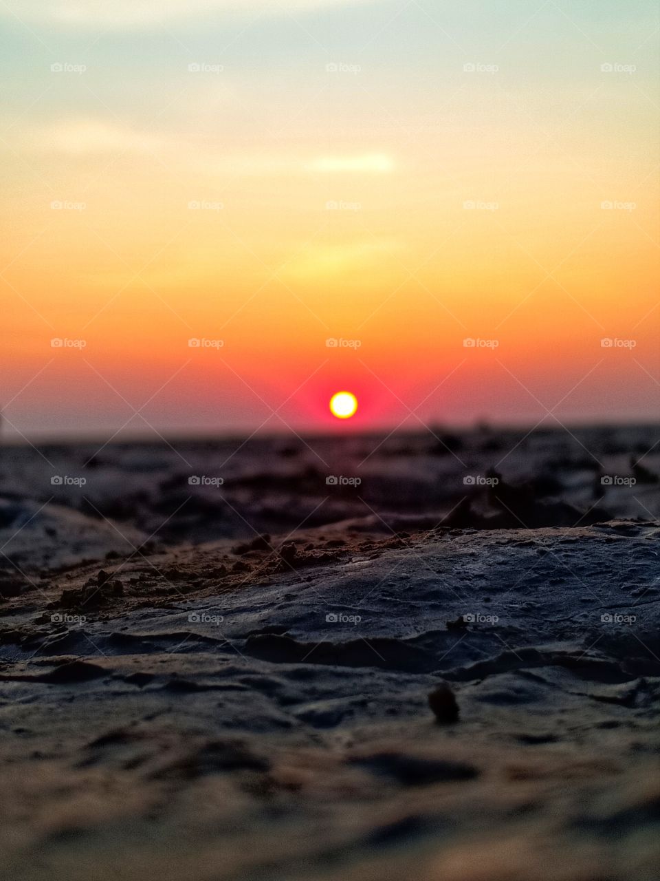 Sunset on sandy beach