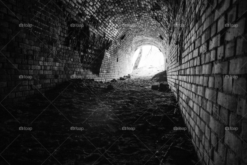 Black-white view underground tunnel in old German factory of the synthetic gasoline
