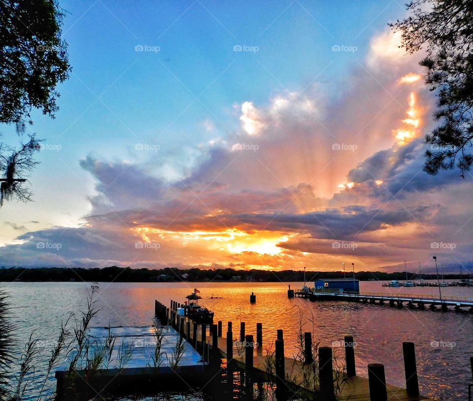 Scenic view of port during sunset