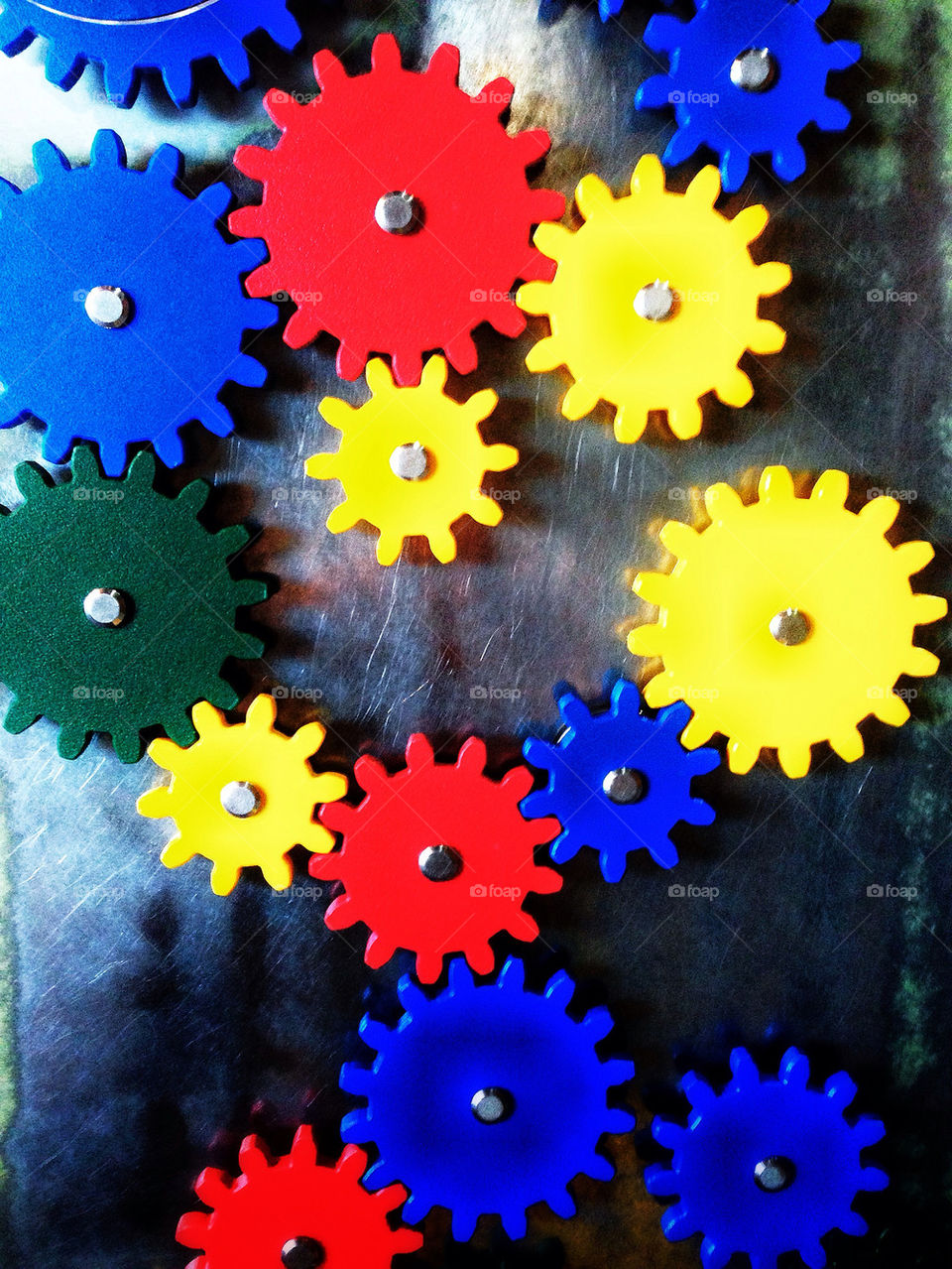 Brightly colored mechanical gears of a childhood educational toy