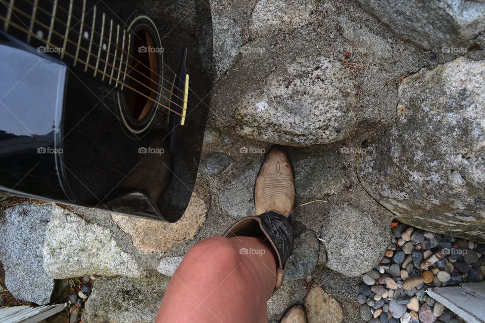 Point of view country western woman with guitar climbing stairs legs cowboy boots