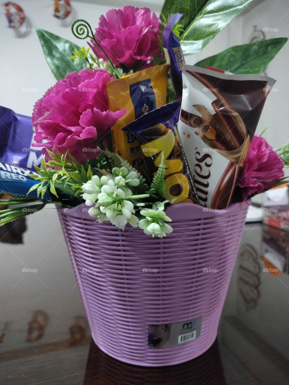 flower with chocolate in vase