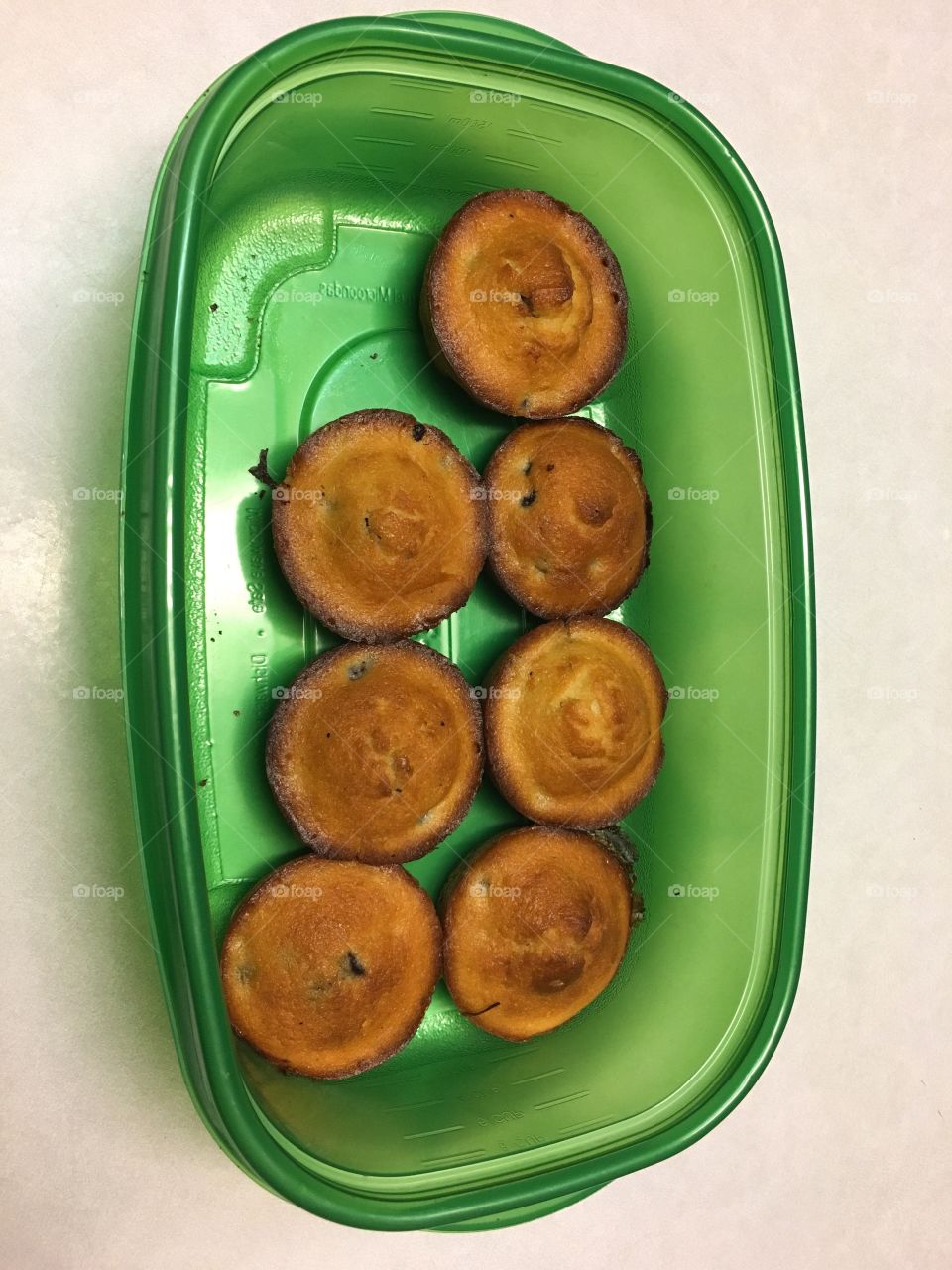 Muffins in green container
