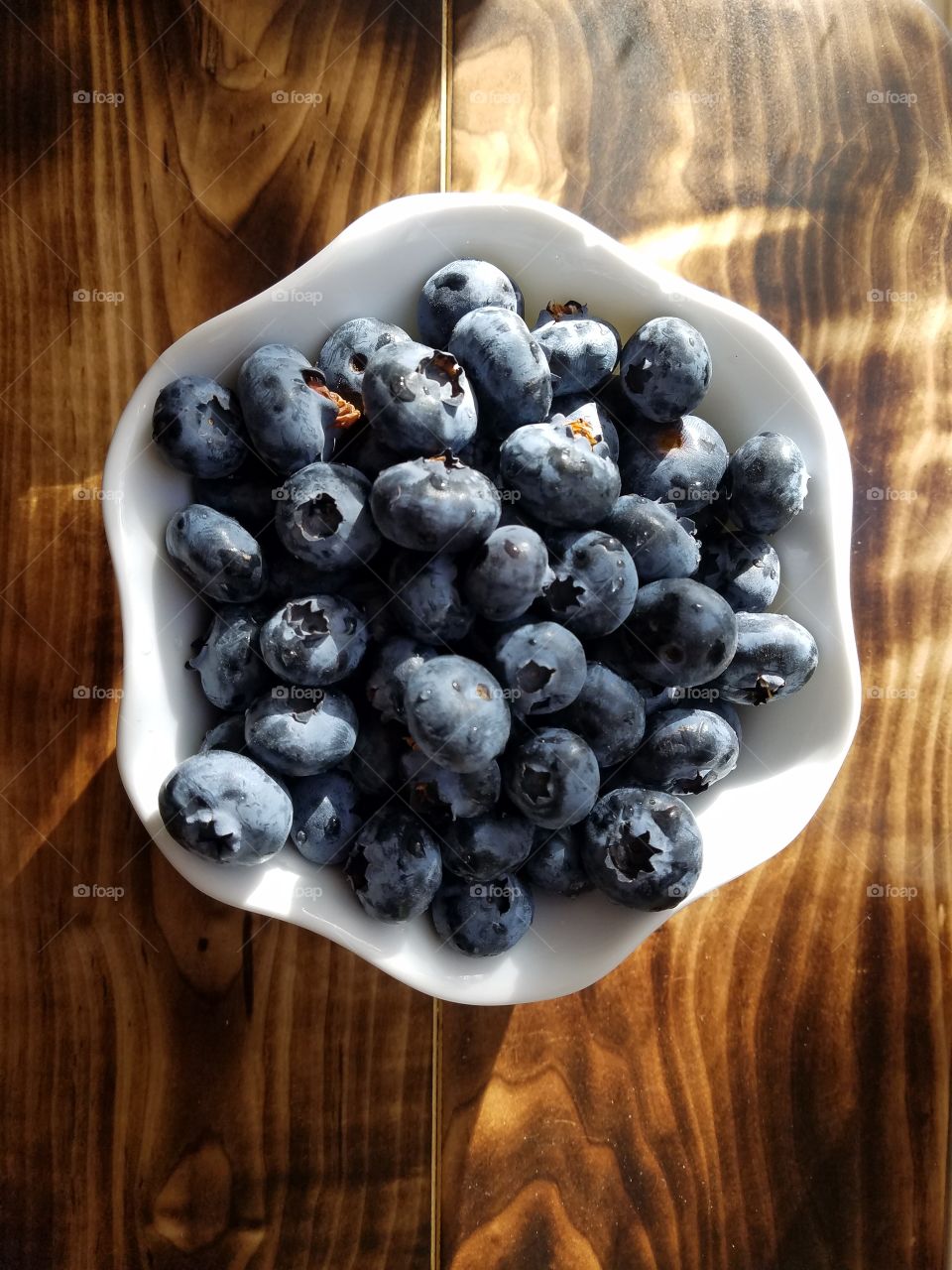 Blueberries in bowl over the table