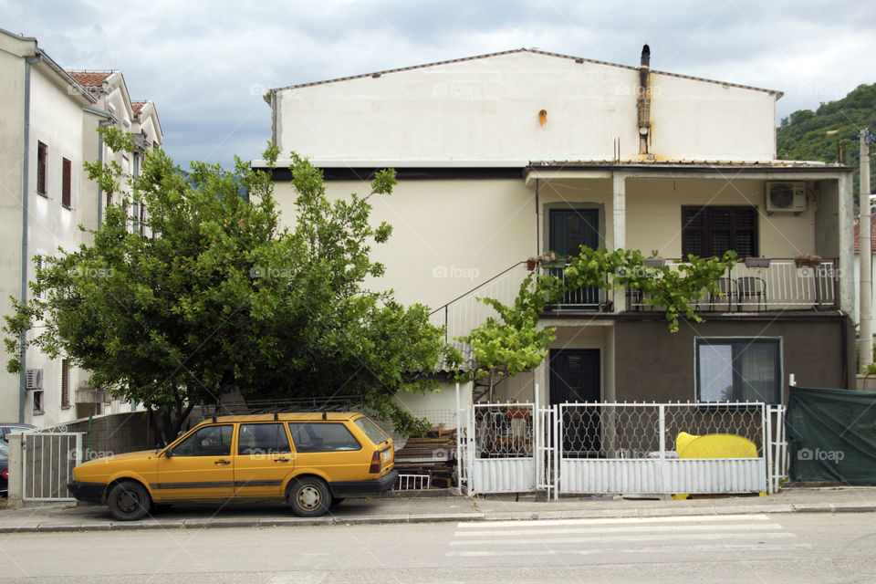 Yellow old car in the street