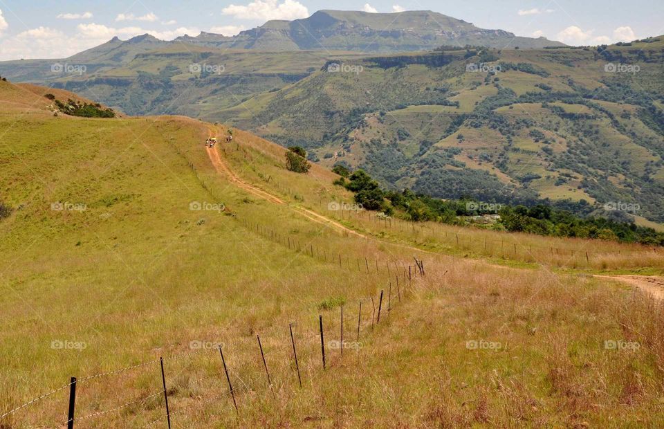 Two track road on KZN mountain farms being exlored by motorbike. Mountains explored