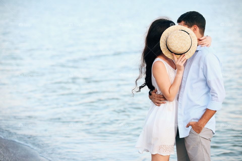 Summertime. Love couple on the beach