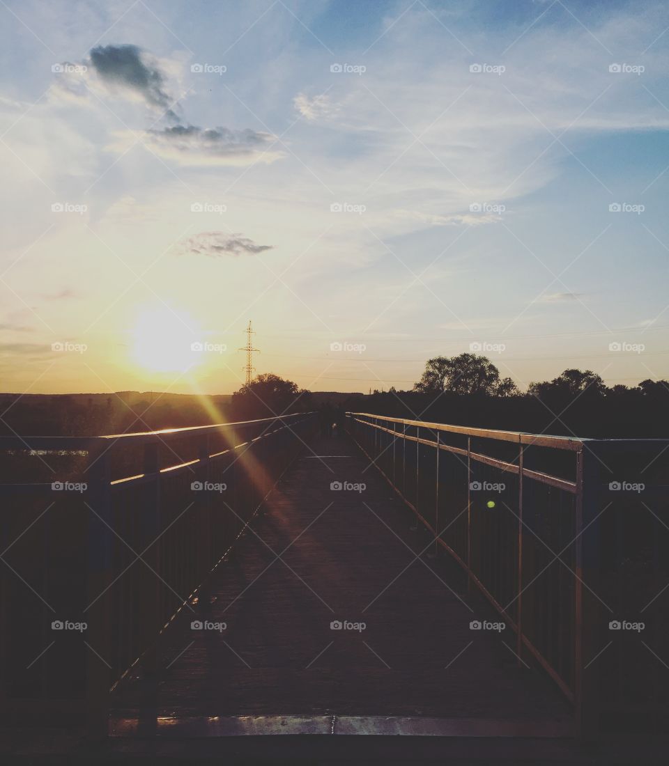 Sunset on the way onto a bridge 