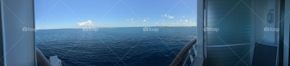 A view of the sea and the string of islands that make up the Bahamas. A beautiful sunny day with a few scattered clouds invite a mindset of serenity, providing calmness to the mind and the body.  