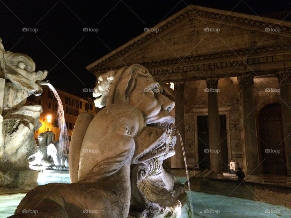 Fountain and Pantheon at night in Rome. 