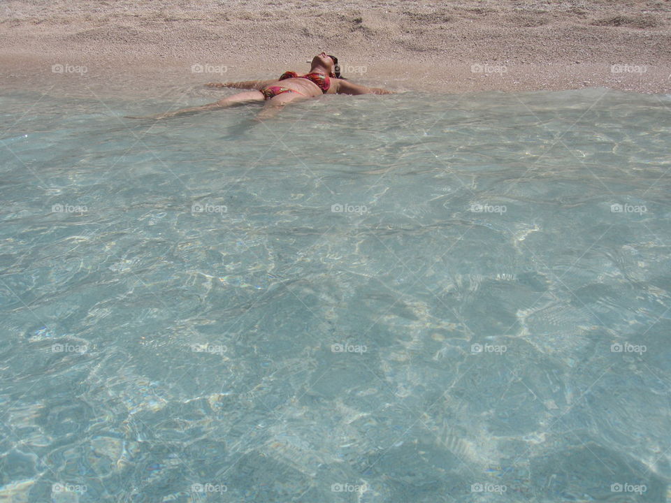 woman in the sea enjoying sun