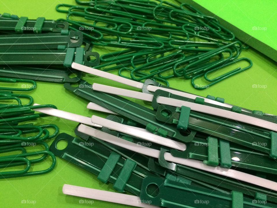 Group of green paper clips