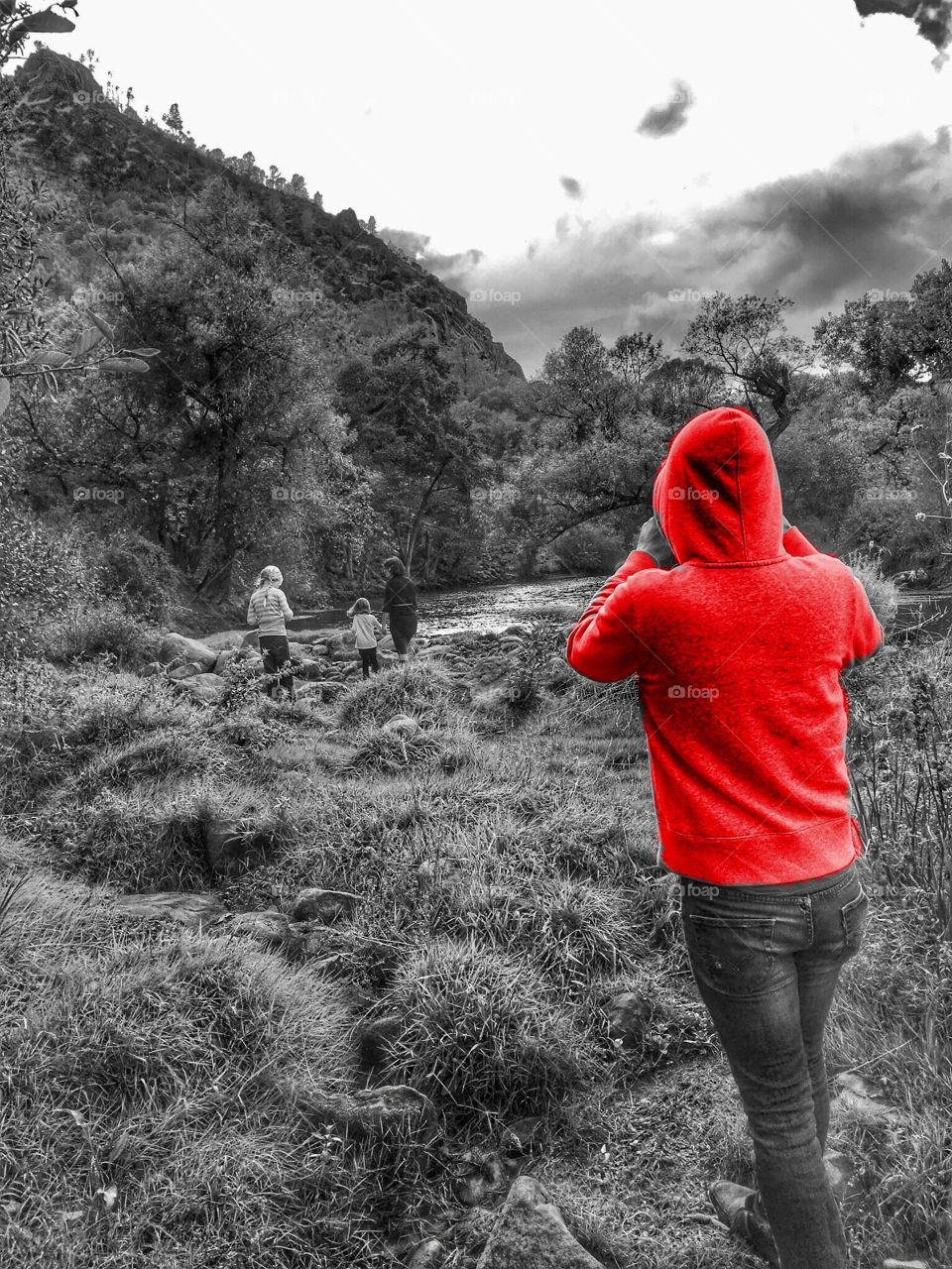 Red hoodie on black and white photo. 