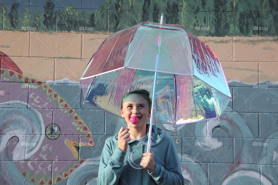 Girl holding Iridescent umbrella