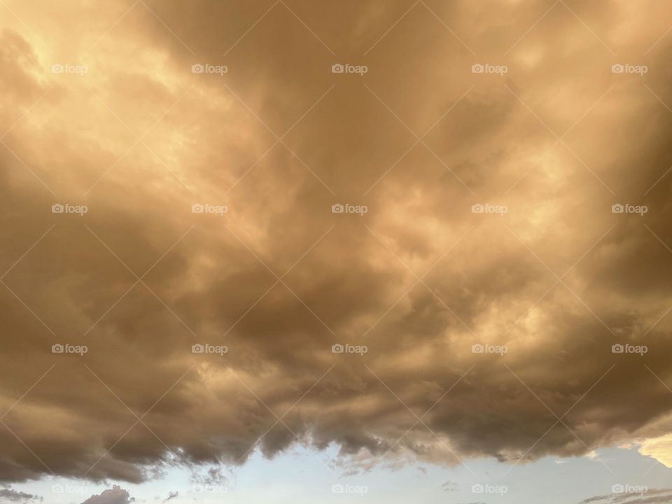A sky with yellow clouds. 