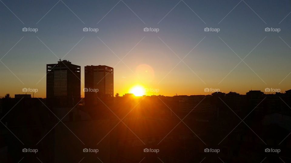 Sunrise in Milan. Sun ans skyskraper...Wonderful wake up.