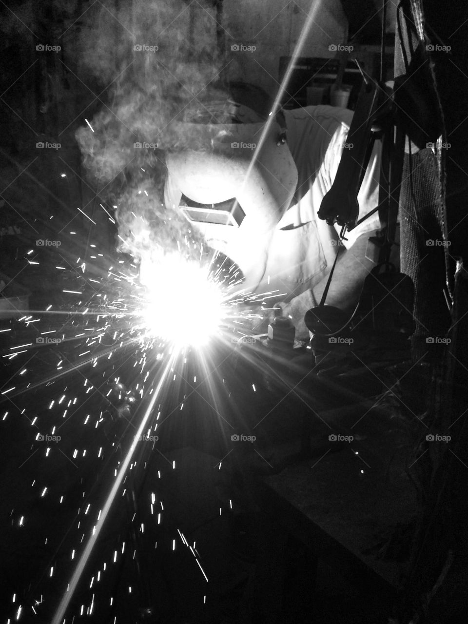 Welder. welding in a machine shop
