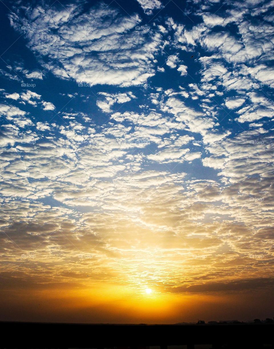 Sunrise with cloudy sky