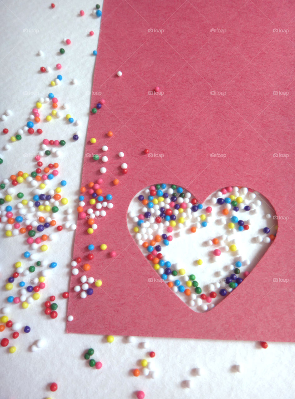 Paper cut out heart with sprinkles